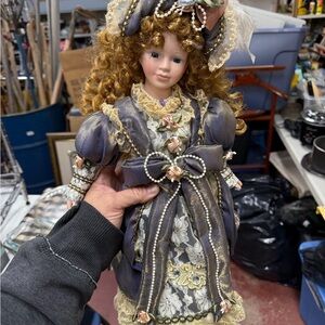 Elegant Porcelain Doll with Curly Hair